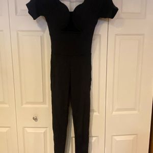 Black jumpsuit , shirt sleeve, never worn. Size large